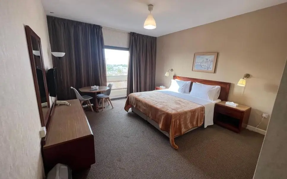 Modern serviced apartment interior with kitchenette and living area