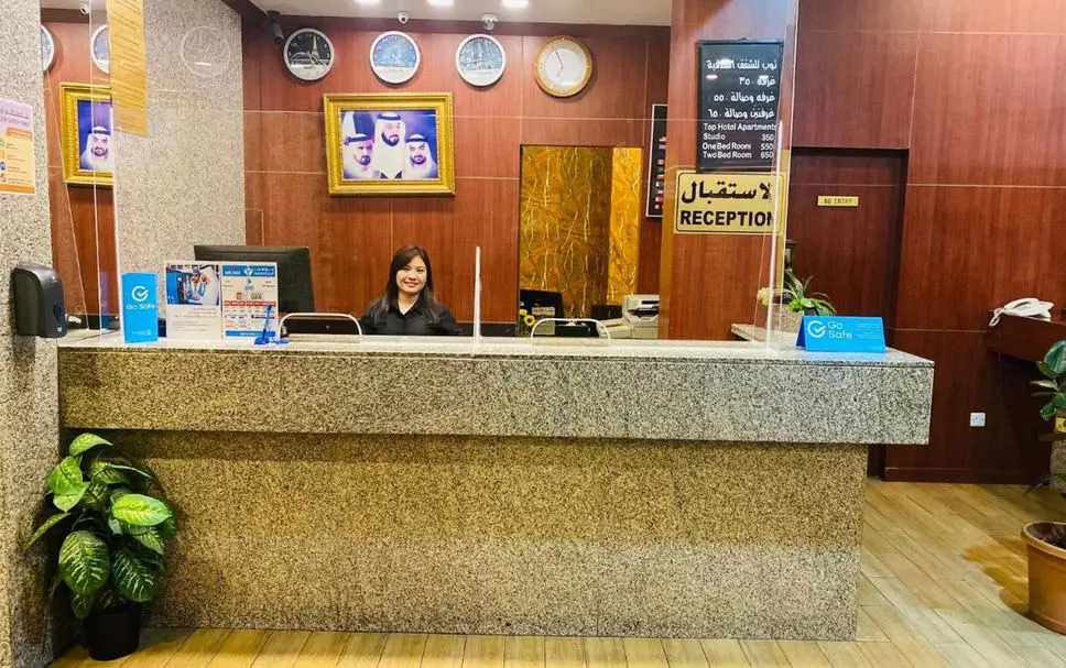 Spacious bedroom with comfortable bed and sofa